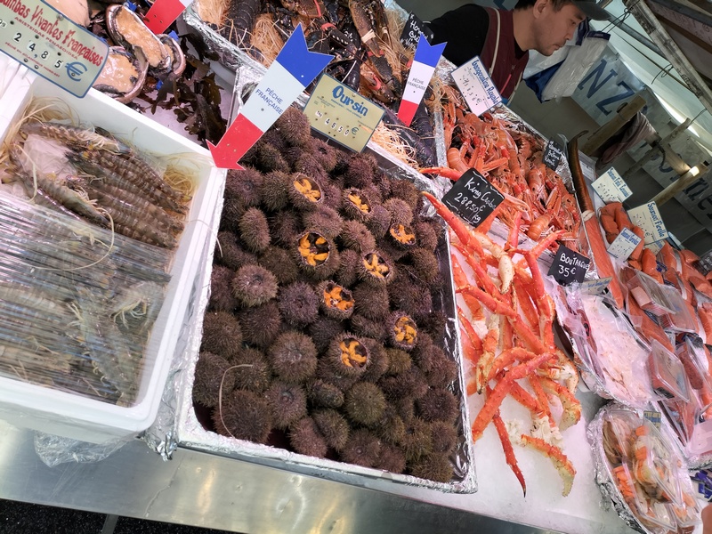 Sea urchins at a fish stall in the President Wilson open-air market in Paris